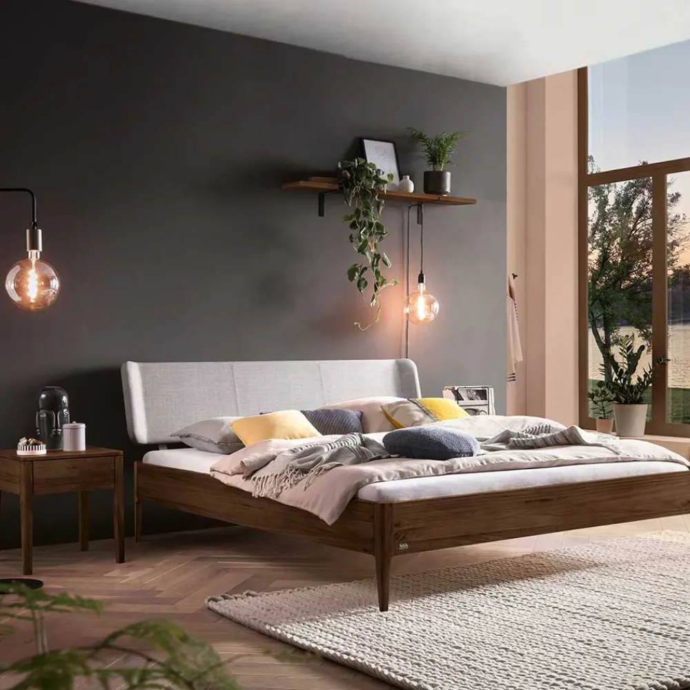 Wohnen Betten<Nussbaum Bett mit extravagantem Kopfteil - Astosa